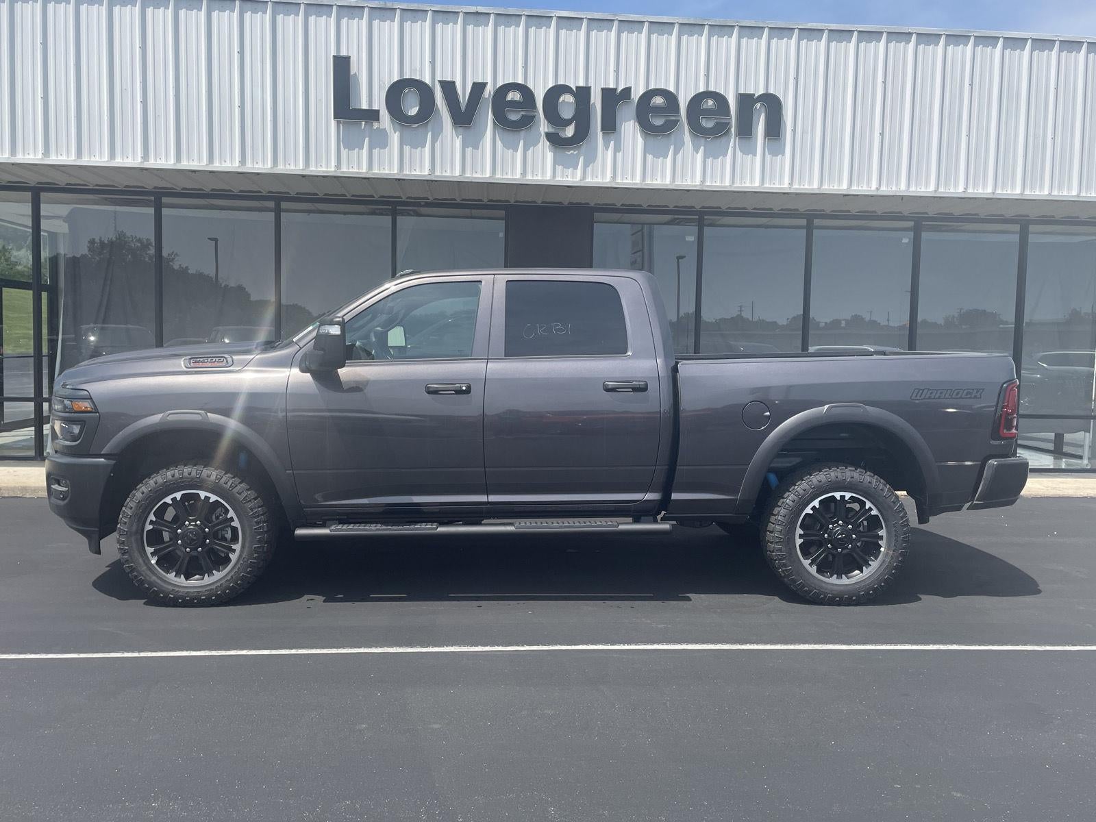 2026 RAM Ram 2500 RAM 2500 WARLOCK CREW CAB 4X4 6'4' BOX in Granite Crystal Metallic Clear-Coat Exterior Paint — front three-quarter view